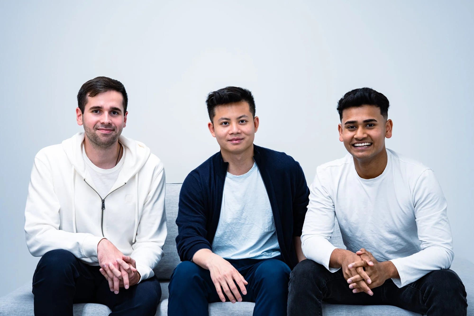 Infisical's founders Vlad Matsiiako, Tony Dang, and Maidul Islam, seated side by side